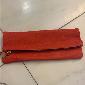Clare Vivier red folder over clutch